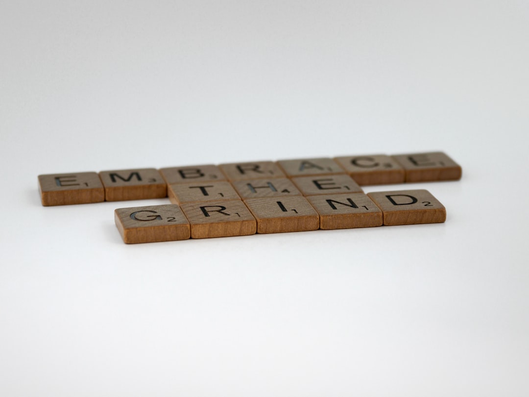 Home scrabble, scrabble pieces, lettering, letters, wood, scrabble tiles, white background, words, quote, letters, type, typography, design, layout, focus, bokeh, blur, photography, images, image, embrace the grind, work, hard work, training, weight training, fitness, learning, life, success, secret of success, keep going, embrace boredom, dont give up, endurance, patience,
