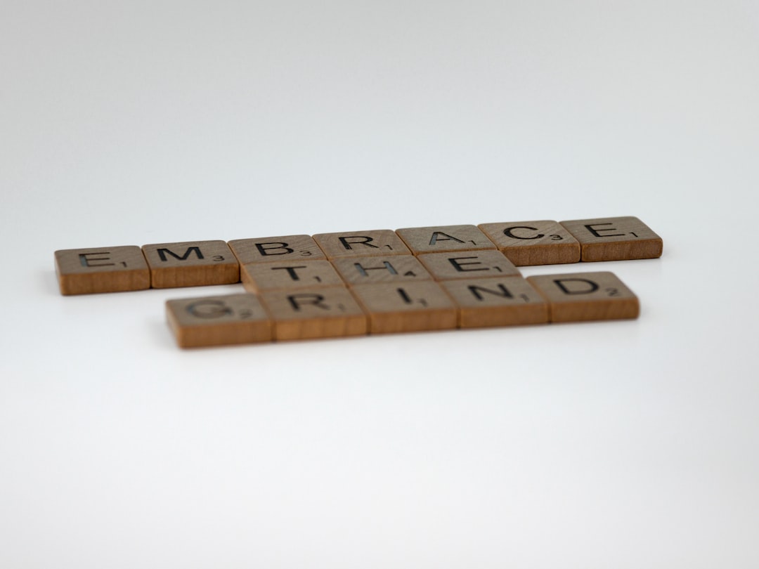 Home scrabble, scrabble pieces, lettering, letters, wood, scrabble tiles, white background, words, quote, letters, type, typography, design, layout, focus, bokeh, blur, photography, images, image, embrace the grind, work, hard work, training, weight training, fitness, learning, life, success, secret of success, keep going, embrace boredom, dont give up, endurance, patience,